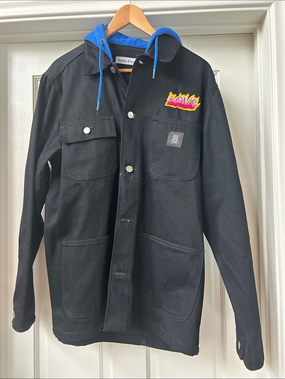 Teddy Fresh Black Jacket with Blue Hood and Colorful Patch
